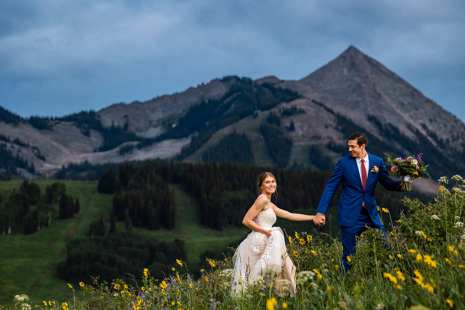 Champagne toast celebration in Colorado wildflower valley